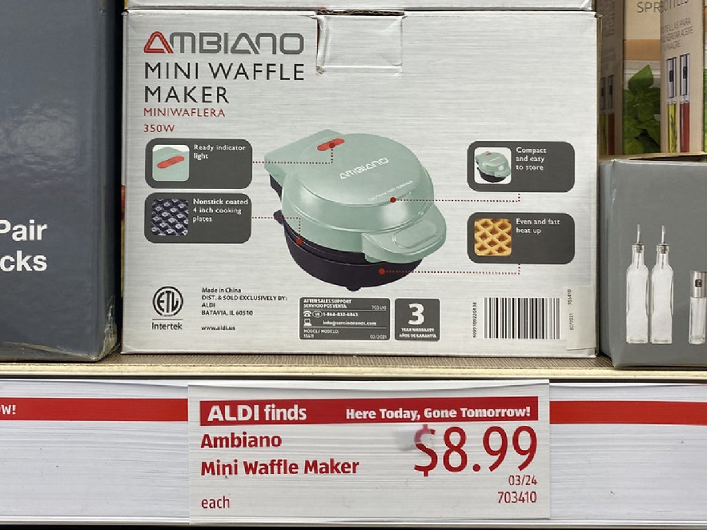 store shelf with boxes that contain small waffle makers in them