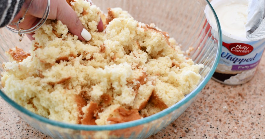 crumbling a cake in large bowl