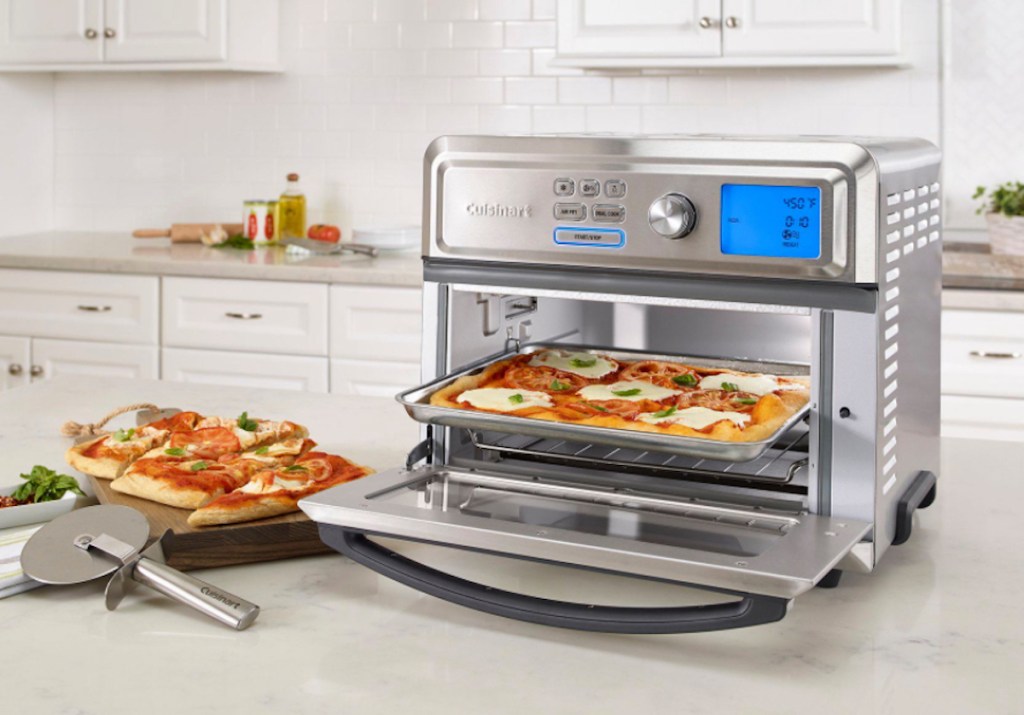 stainless steel toaster oven sitting in white kitchen