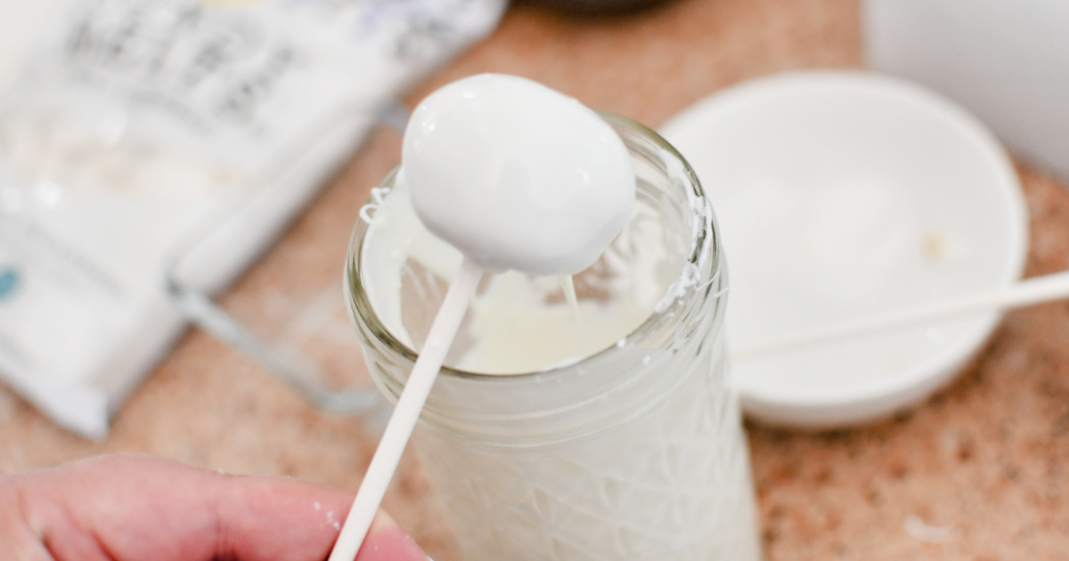 dipping cake balls into melted candy melts 