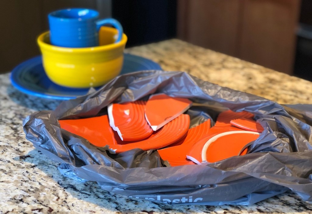 broken plate on granite kitchen countertop