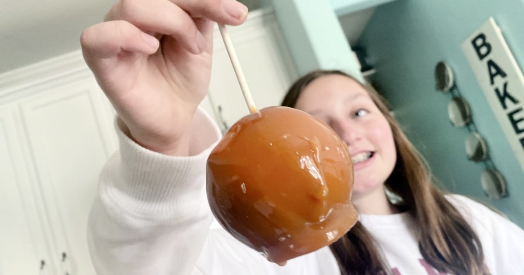 girl holding a caramel onion april fools prank