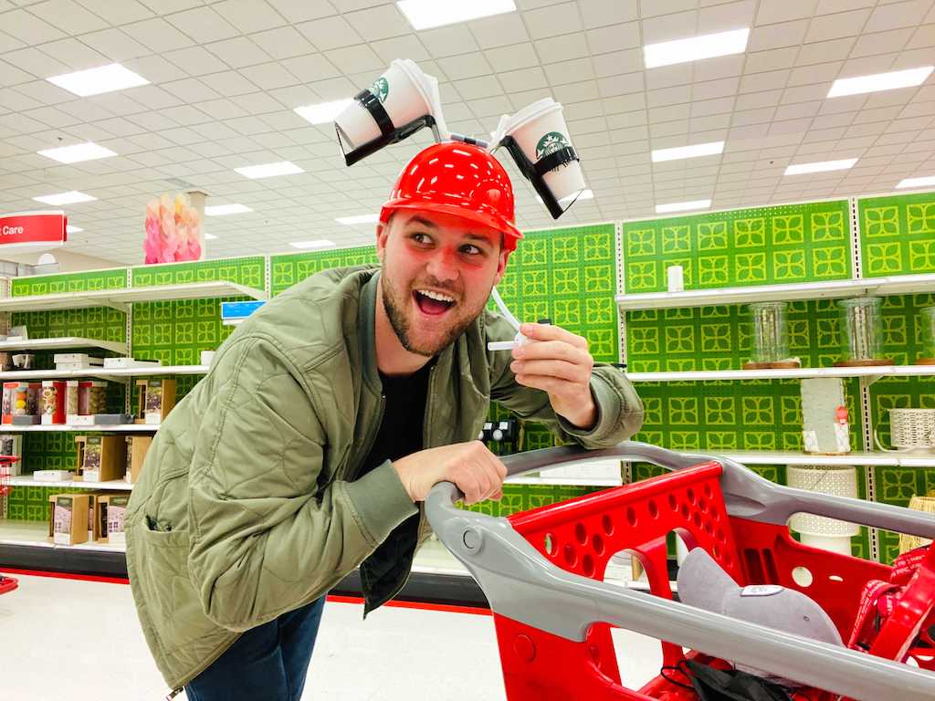 man in Target shopping with coffee helmet 