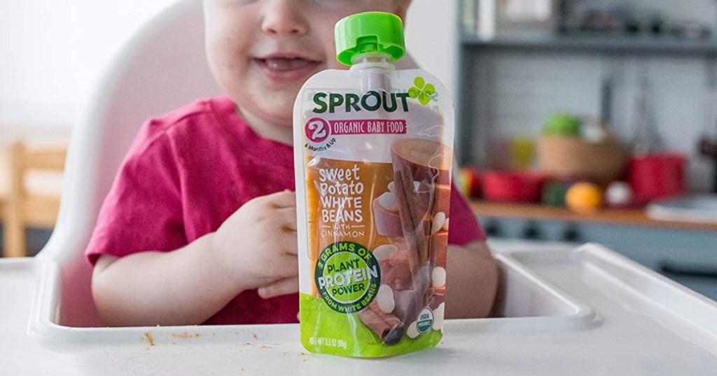 sprout baby food pouch with baby in high chair