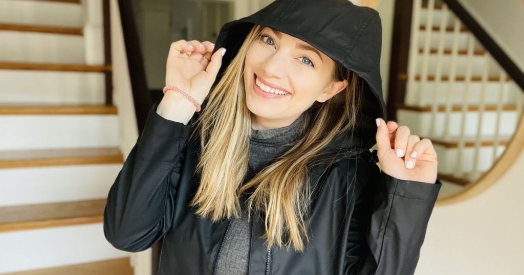 woman wearing a jacket and smiling at the camera