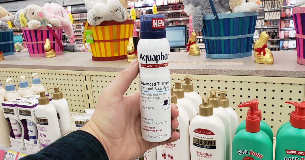 hand holding Aquaphor Body Spray