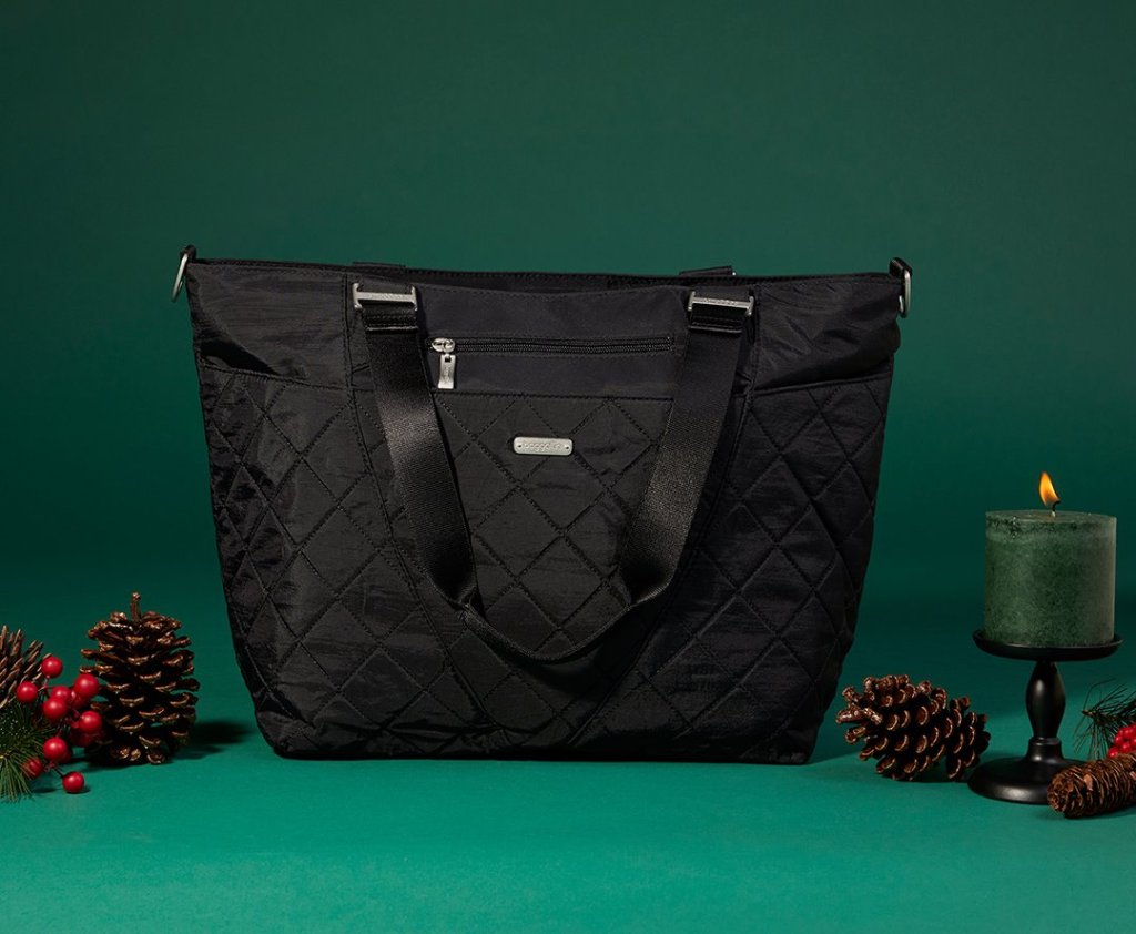 baggallini black bag with green background