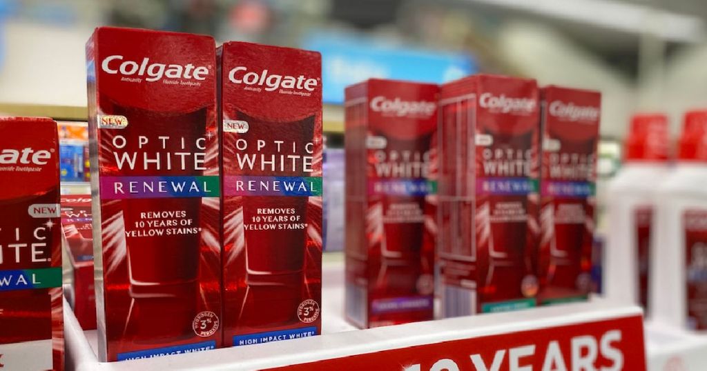 red boxes of toothpaste on shelf 