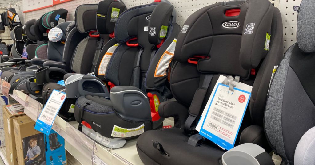 three black carseats on shelf