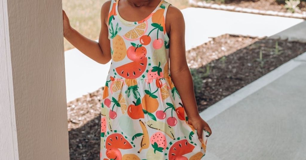 Little girl wearing a sleeveless dress