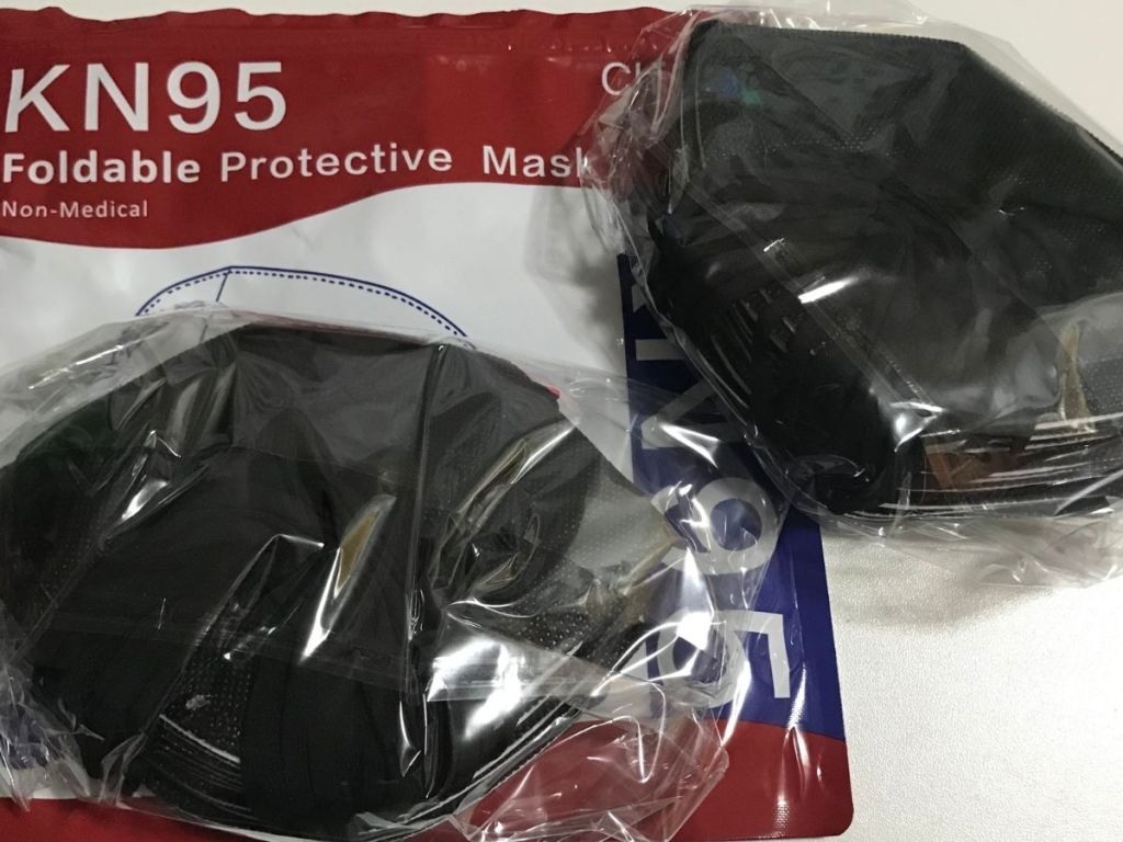 KN95 mask package with black masks individually wrapped