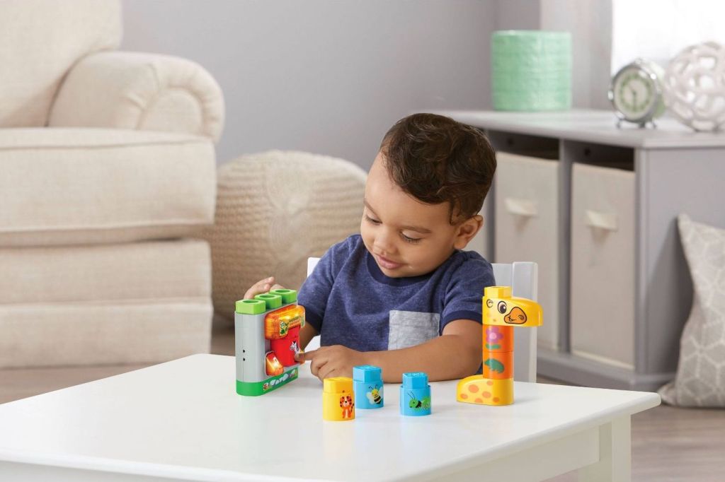 Boy playing Safari Animals LeapFrog Blocks