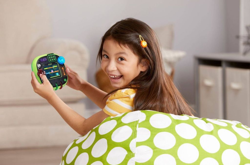 girl playing LeapFrog Rockit