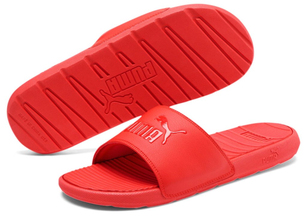 pair of red puma slides