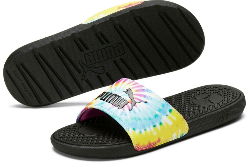 pair of tie dye puma slides