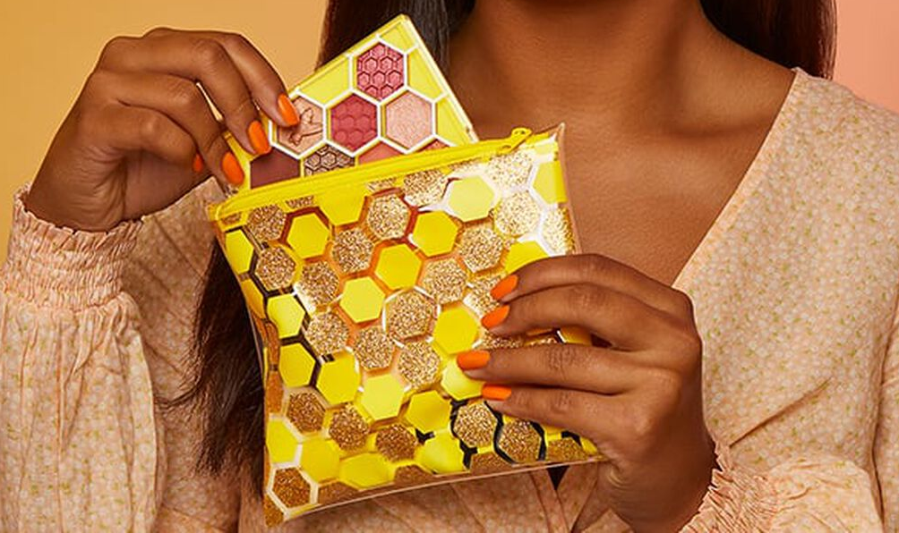 woman holding a cosmetics bag