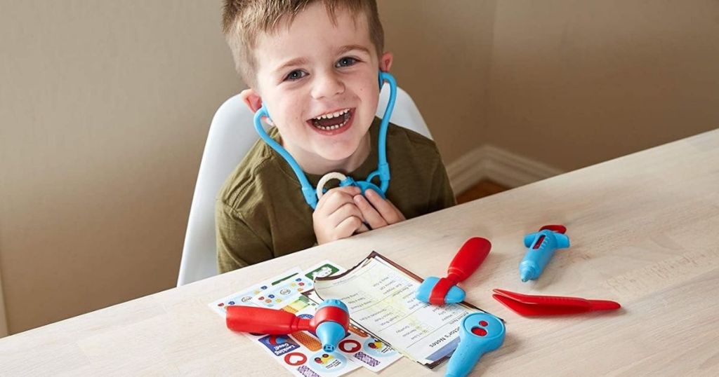 boy playing with doctor kit