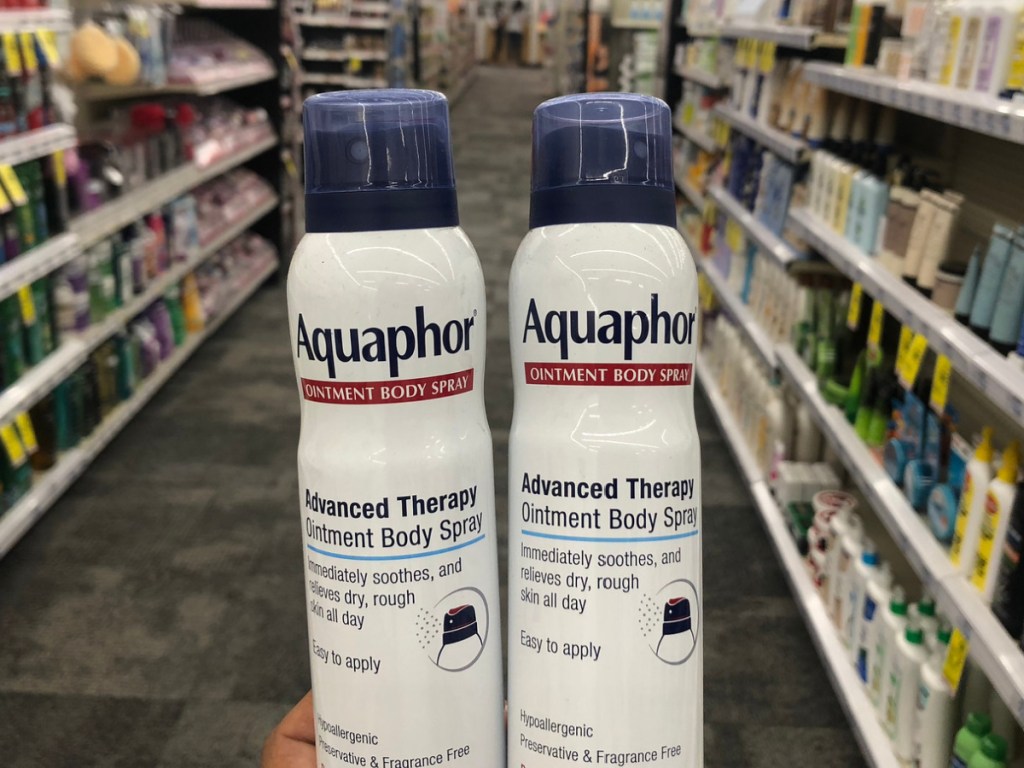 hand holding aquaphor body sprays