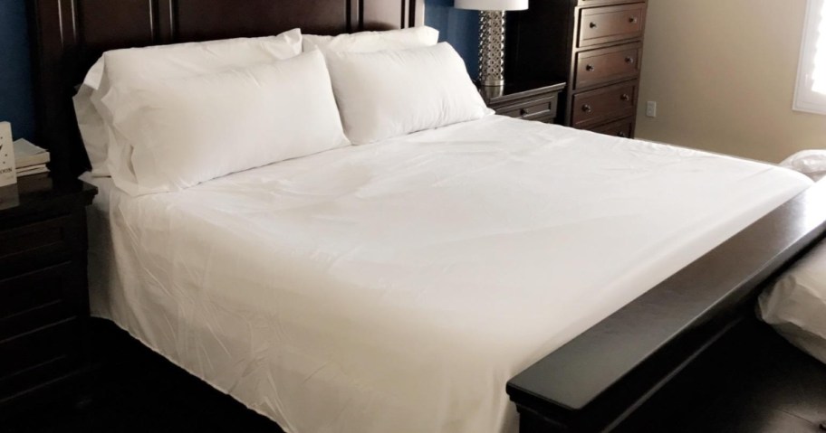 white sheets on queen-size bed