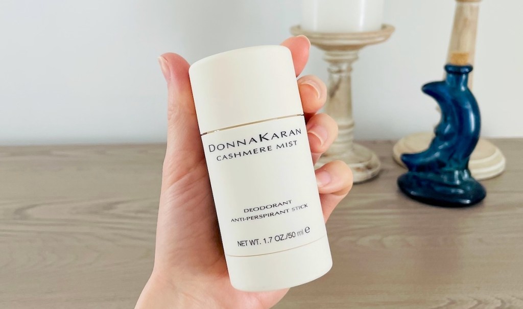 hand holding donna karan cashmere mist deodorant