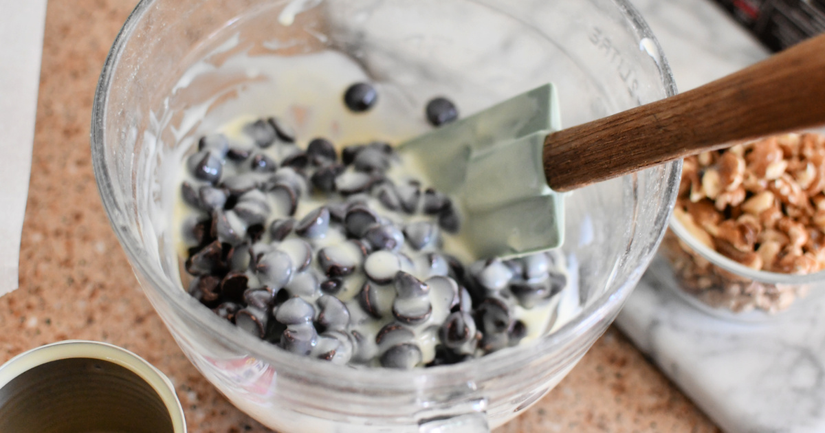 mixing chocolate chips and sweetened condensed milk