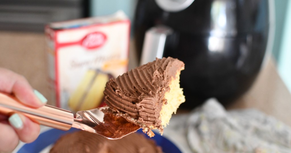 holding a slice of air fryer cake