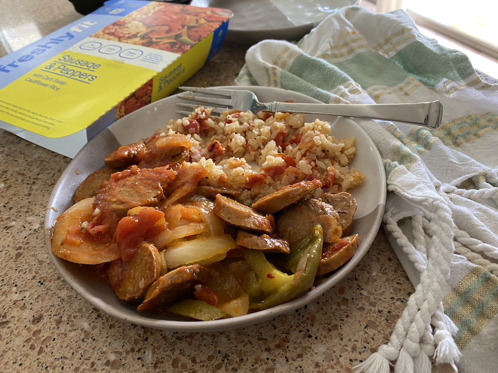 sausage and peppers meal on plate 