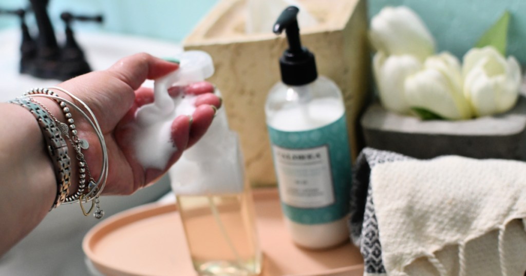 person using diy foaming soap refill