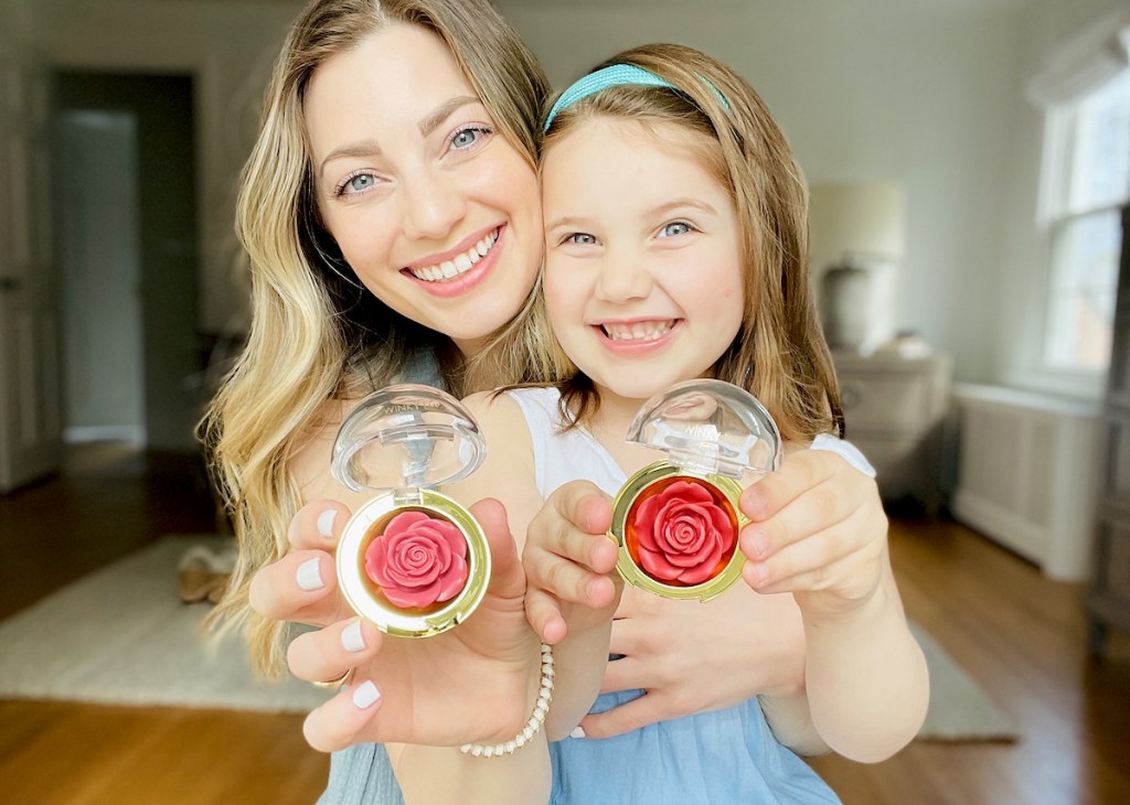 woman and girl holding rose shaped blush makeup 