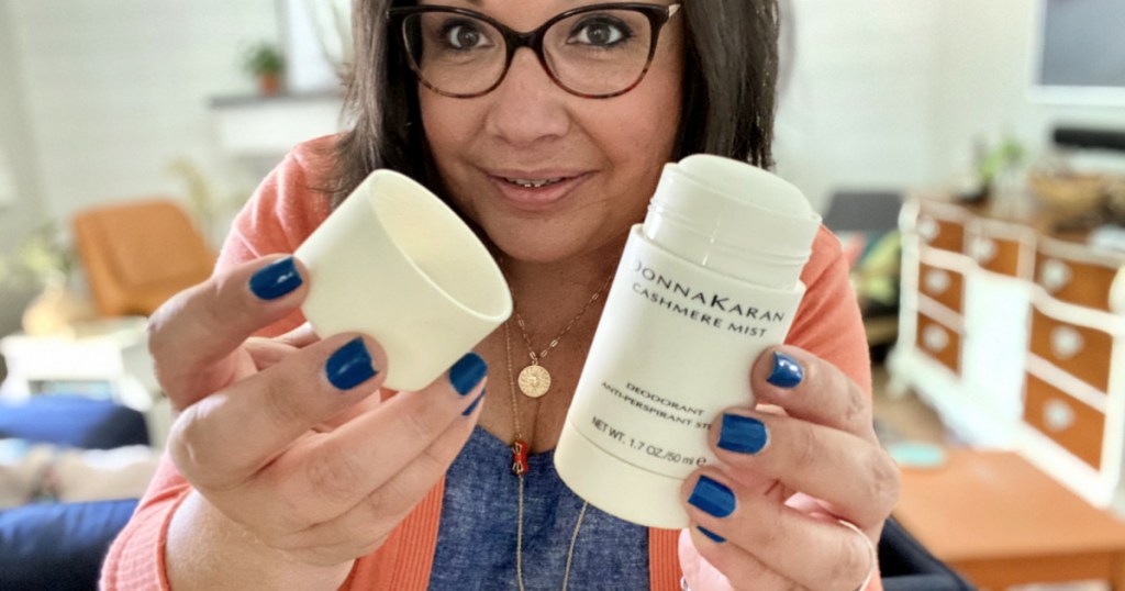 woman holding donna karan deodorant