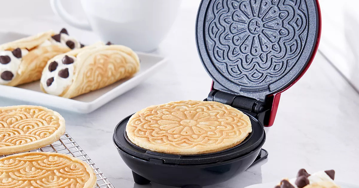 Dash Mini Pizzelle Maker on table top near cannoli 