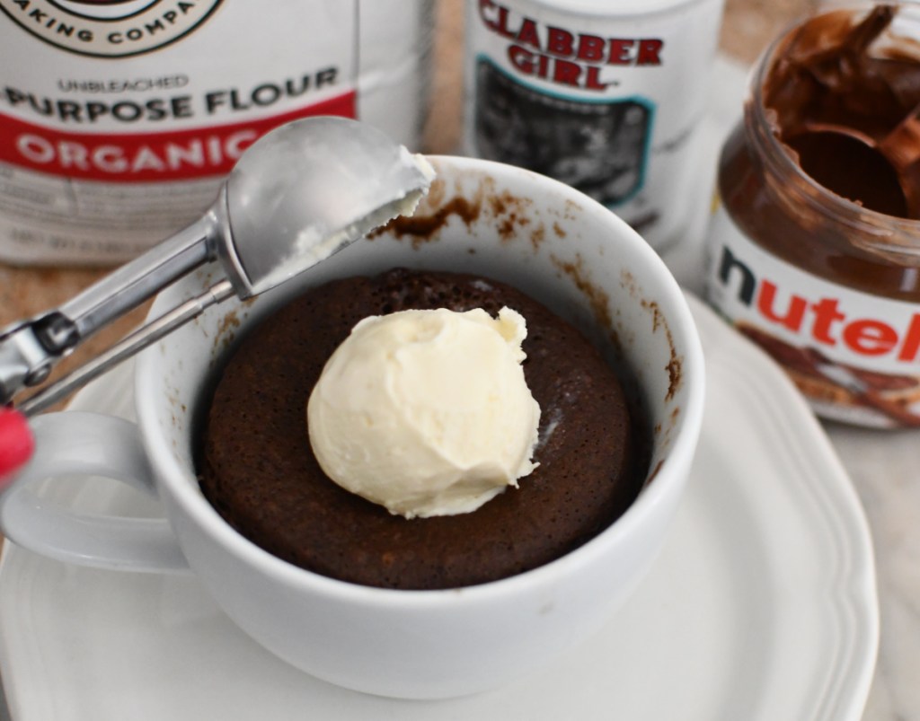 Adding ice cream on top of nutella mug cake