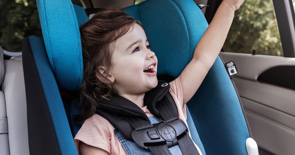 toddler girl in blue car sear