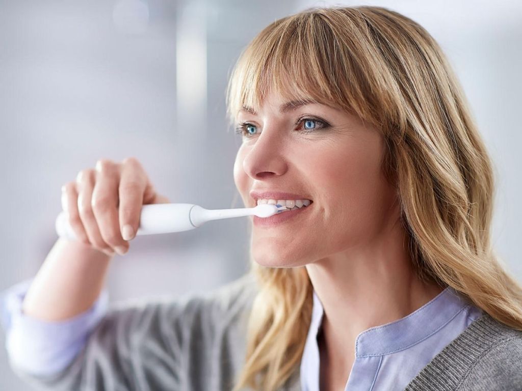 woman brushing her teeth