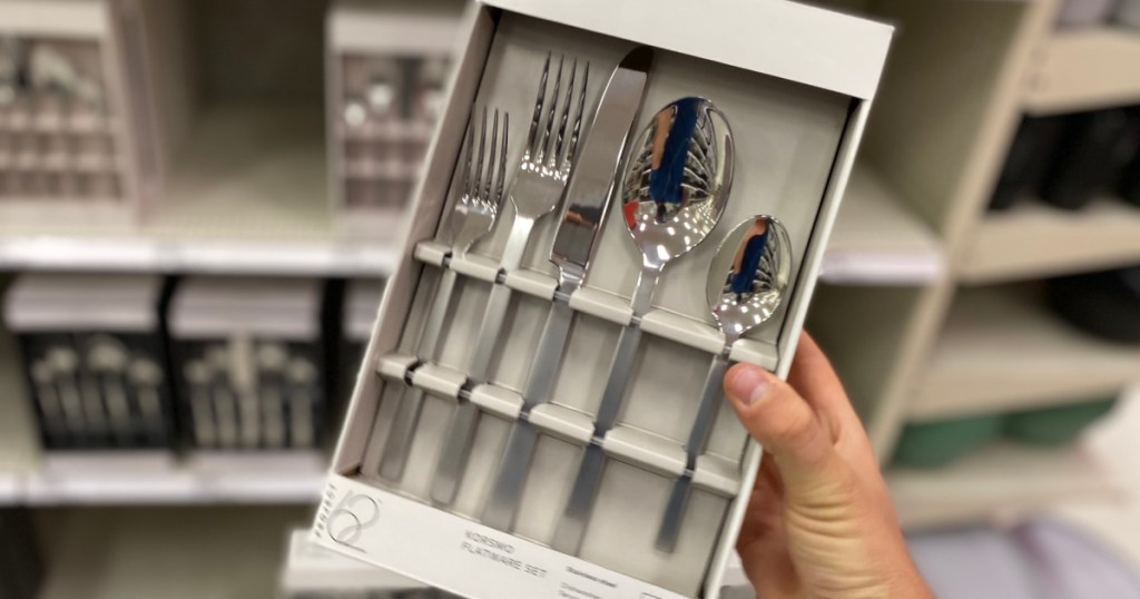 hand holding box of silverware 