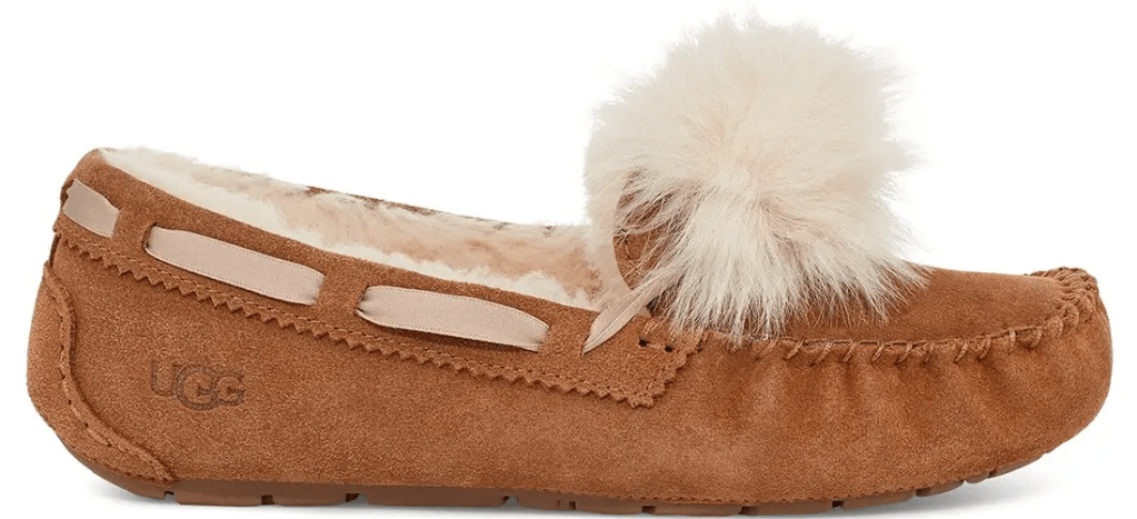 UGG slipper with a pom pom on it