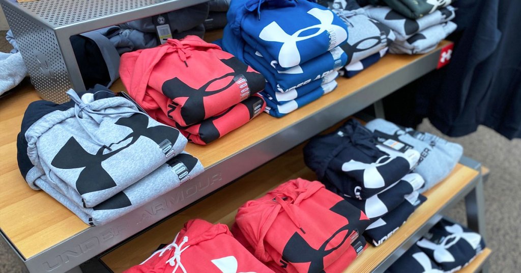 rack of under armour hoodies