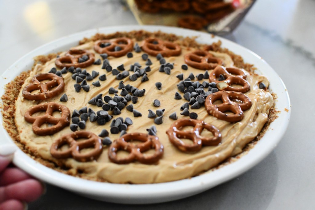 adding chocolate chips to peanut butter pie