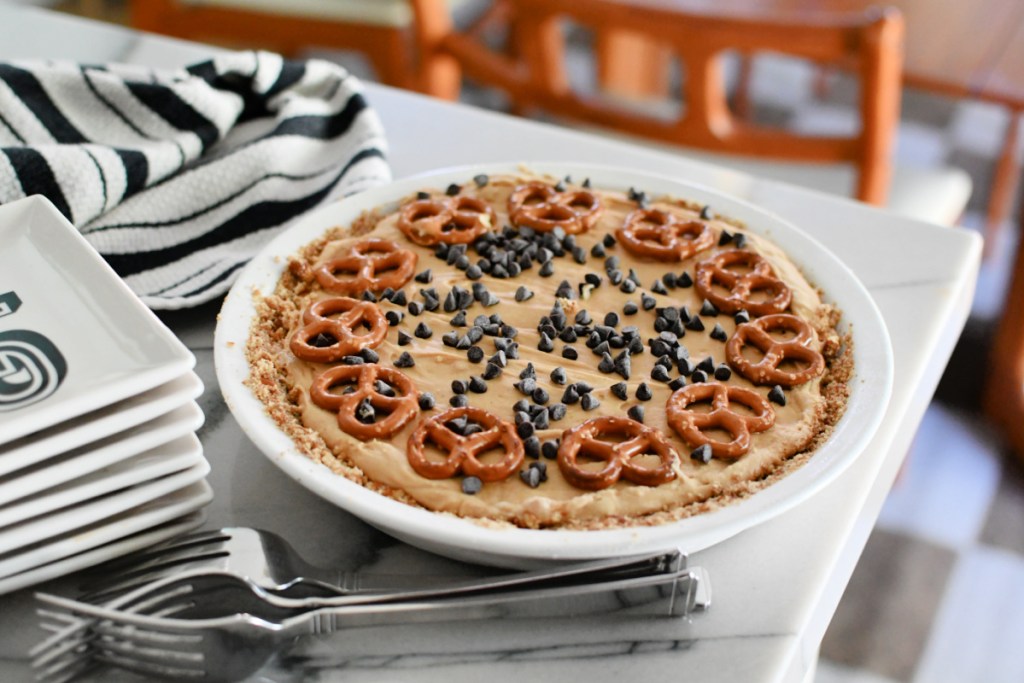 peanut butter pie on the counter with plates