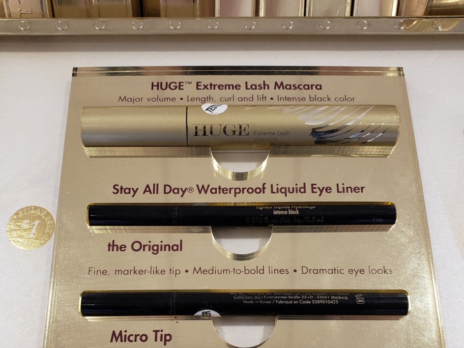 store display with mascara and eye pencils