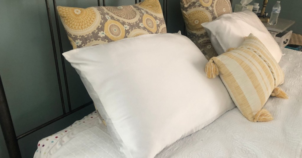 silk pillows on a bed