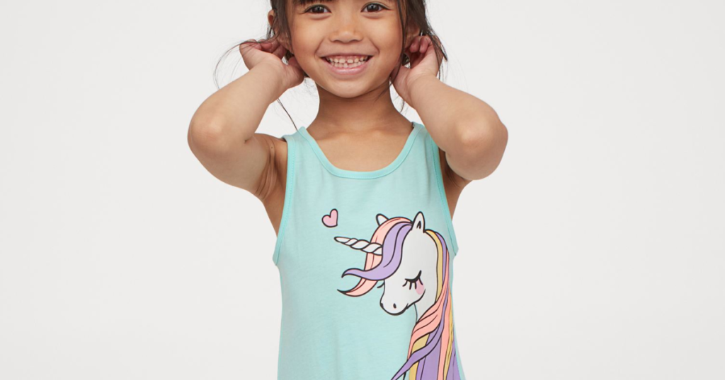 little girl wearing unicorn dress 