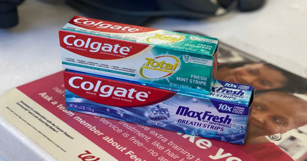 two boxes of toothpaste on store checkout counter