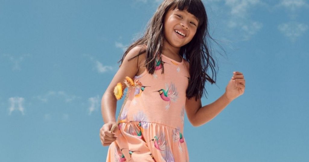 little girl outside wearing a dress