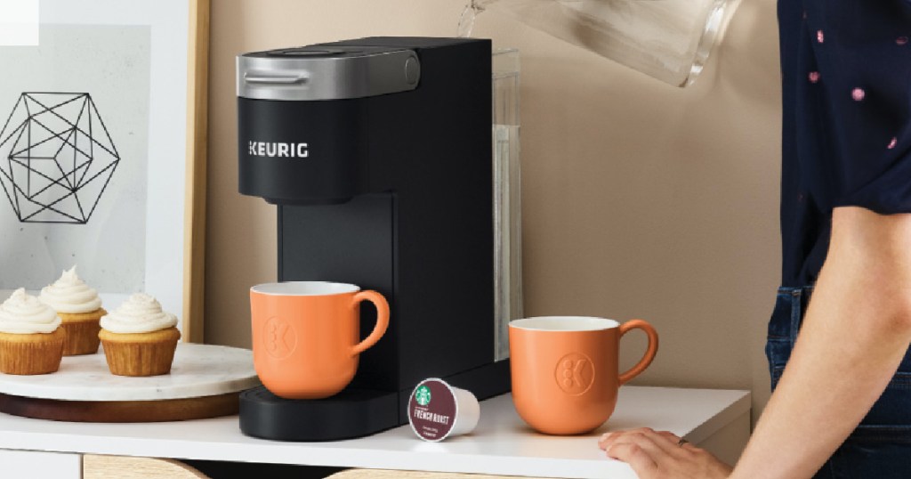 Man pouring water into Keurig K-Slim Coffee Maker