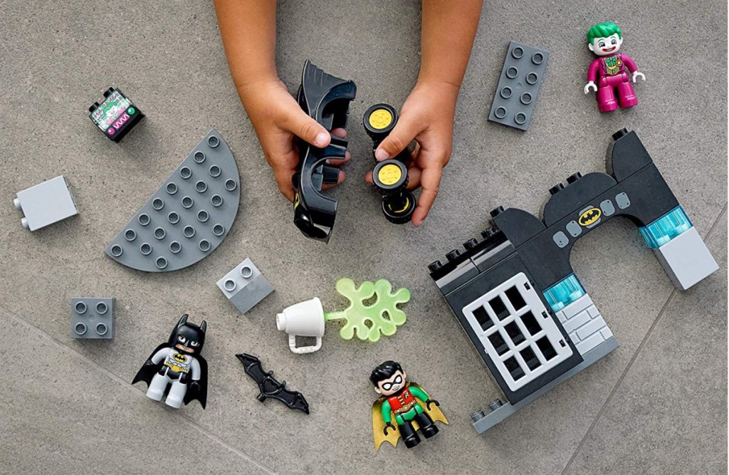 kids hands building a Batman LGO set