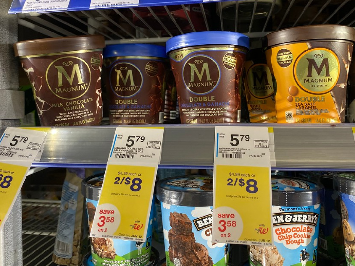 pints of magnum ice cream on a walgreens cooler shelf above ben and jerrys pints