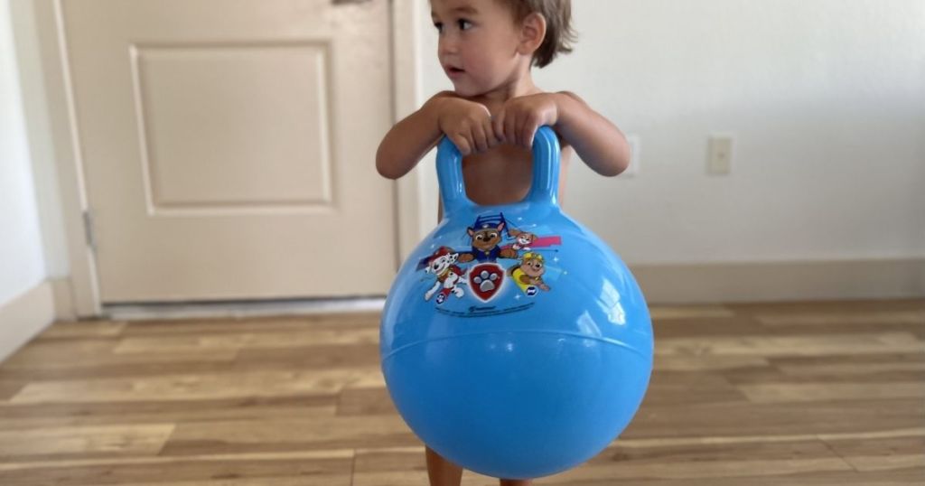 boy holding a toy hopper