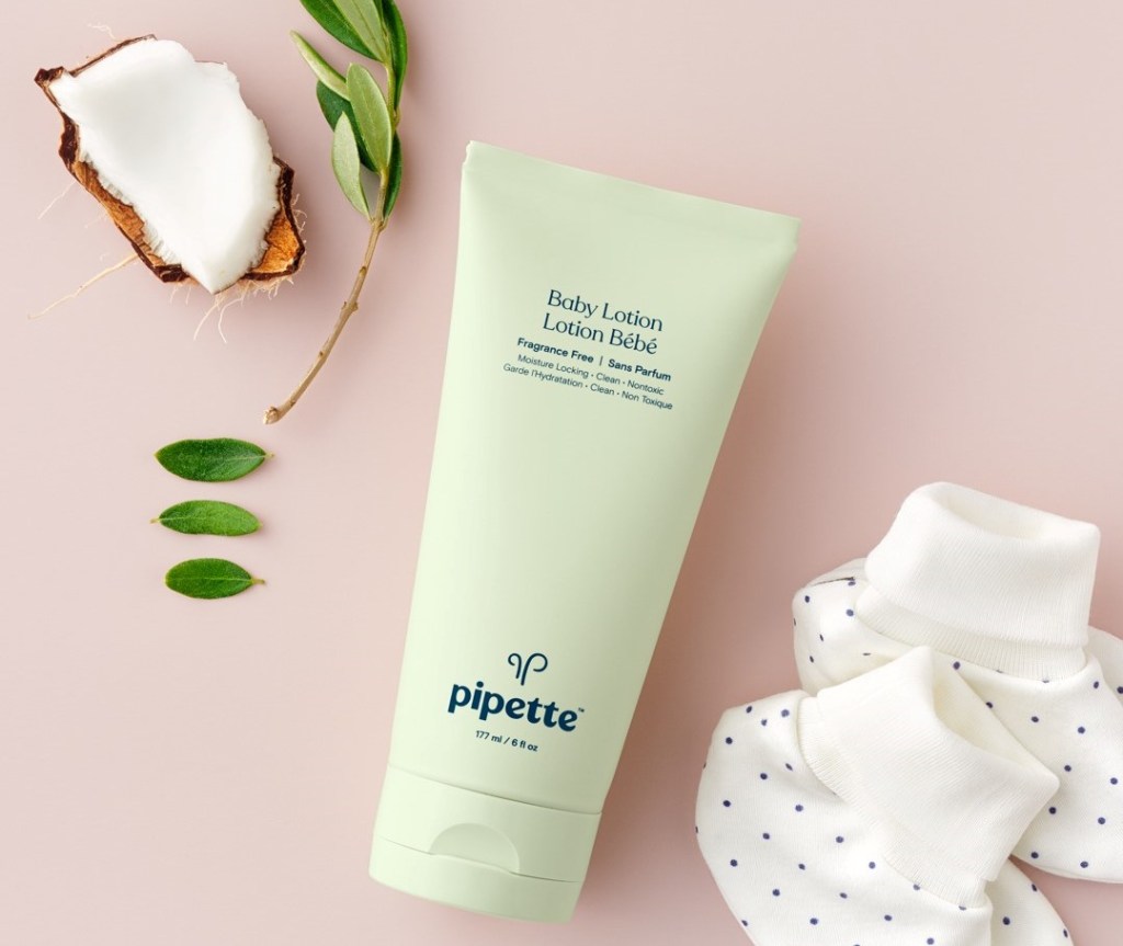 Pipette Baby Lotion with baby booties by it