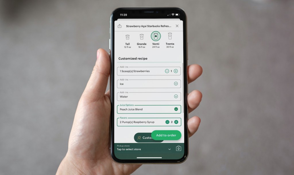 hand holding a phone with starbucks order app on screen